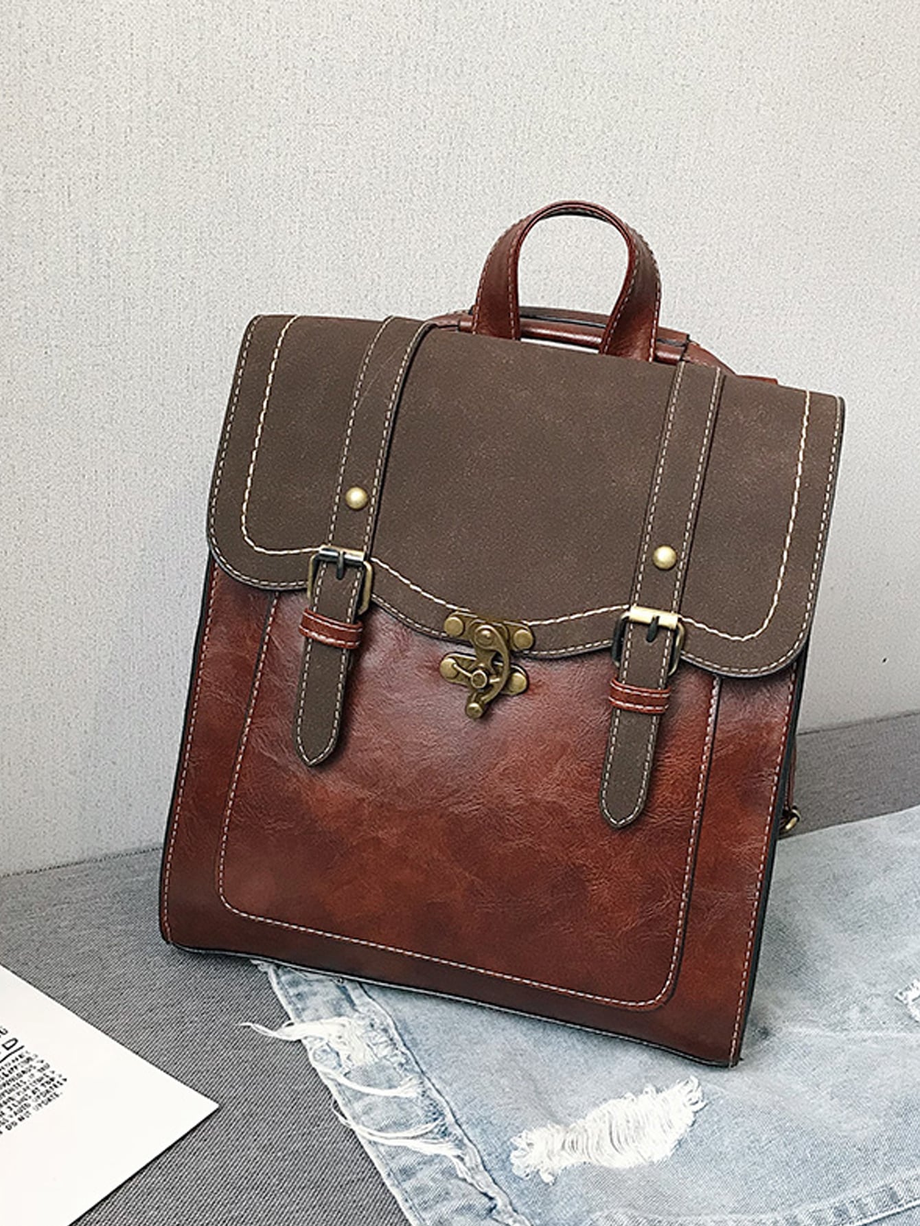 Double buckle decorative flip back backpack