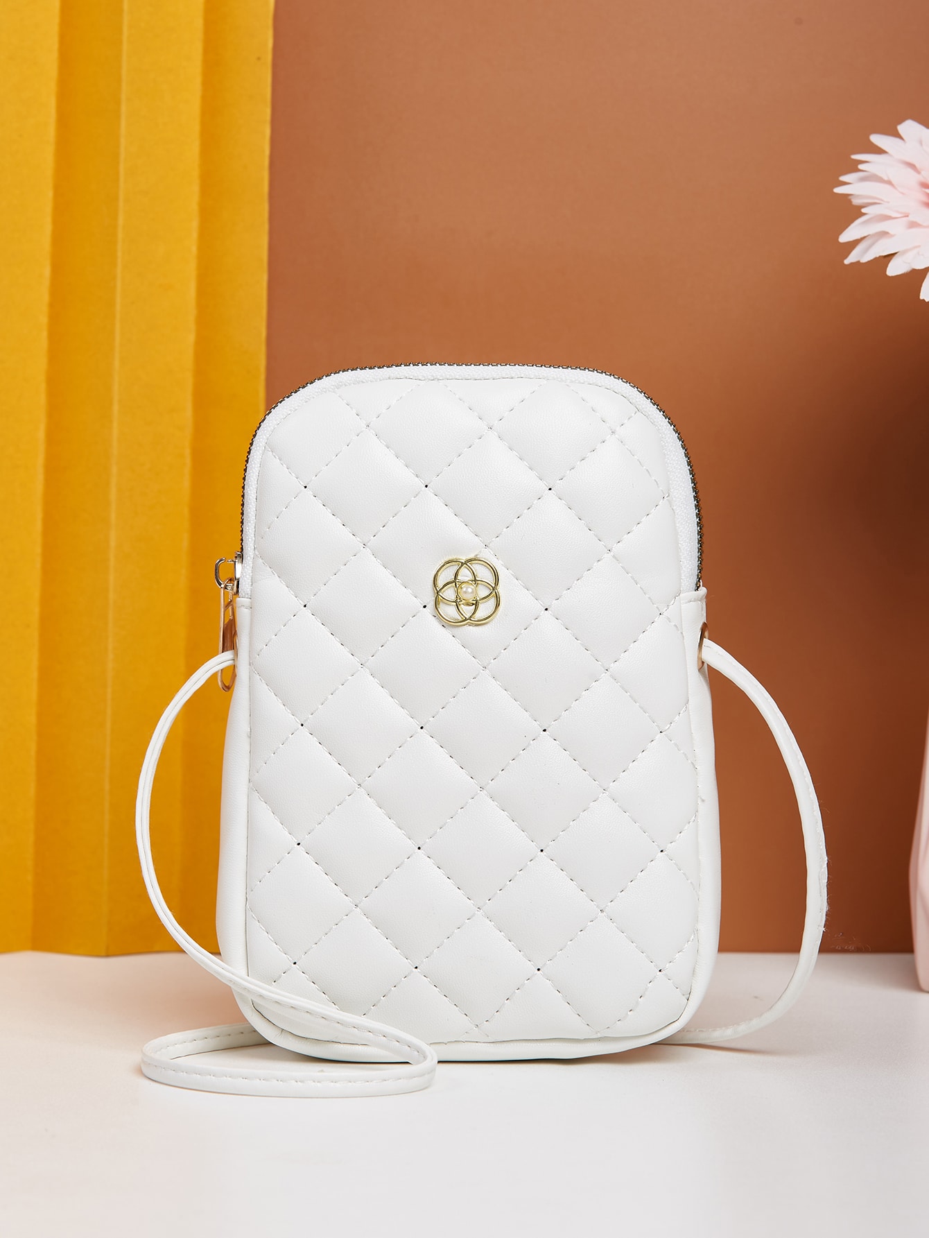 Minimalist quilted metal crossbody bag